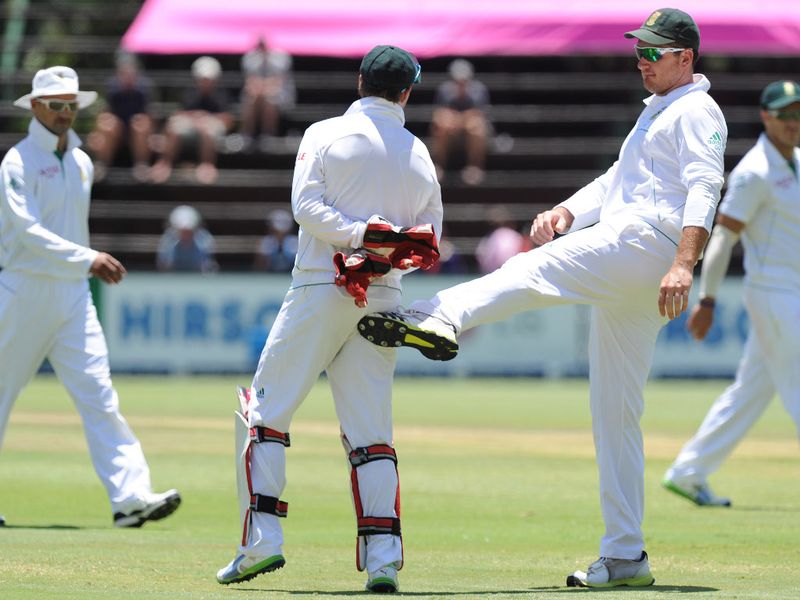 Skipper Graeme Smith gave AB de Villiers a kick in the bum after the keeper took 11 wickets in the match, equalling the record.