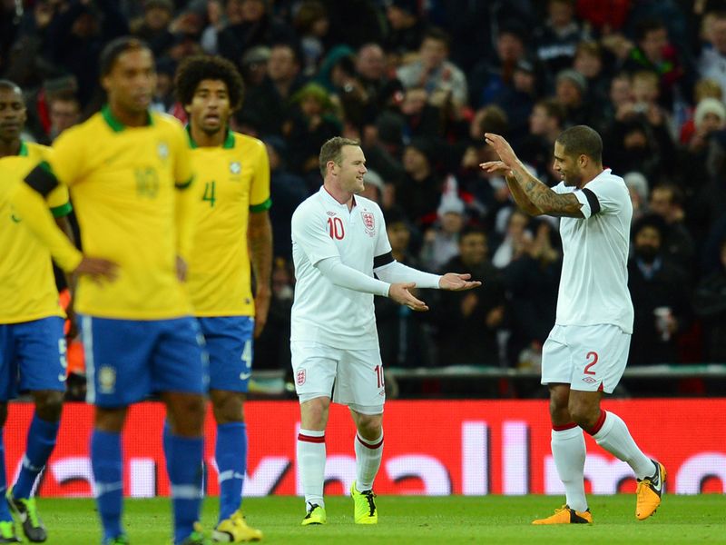 Wayne Rooney celebrates with Glen Johnson after giving England the lead