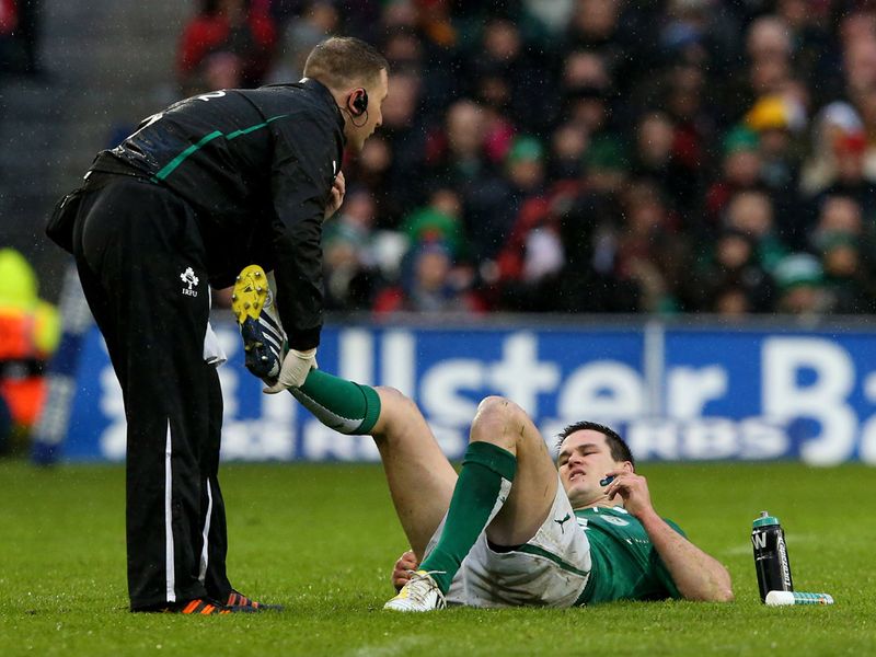 Injury blow: Jonathan Sexton receives first-half treatment but can't continue