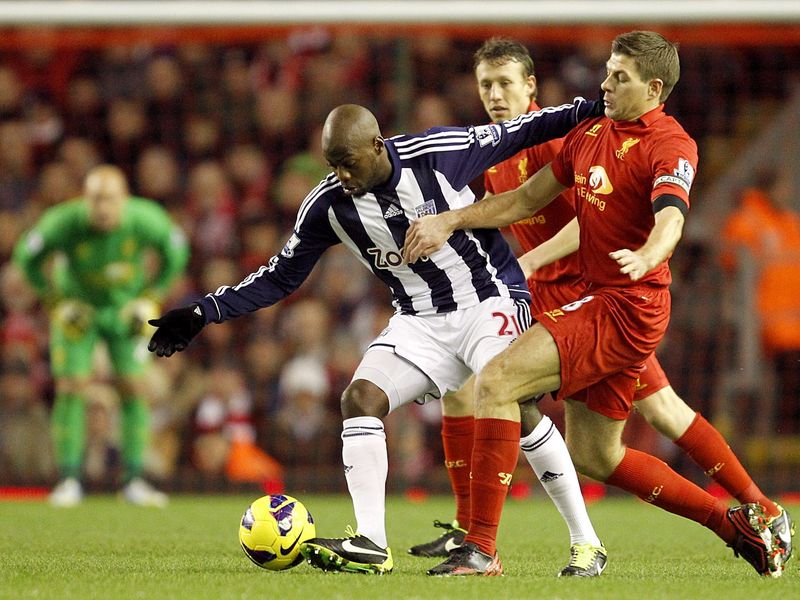 Liverpool captain Steven Gerrard tried to make a tackle on Youssouf Mulumbu.