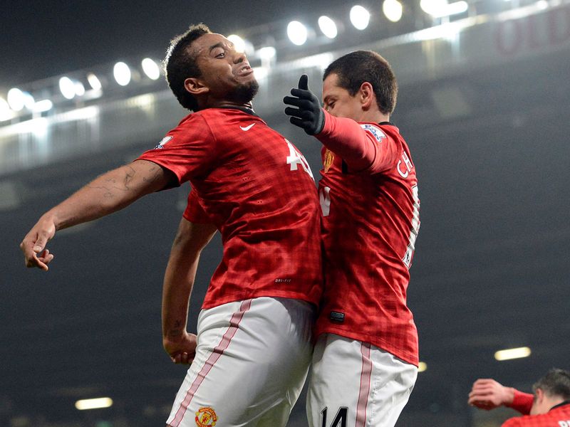 Hernandez bumps chests with team-mate Anderson.