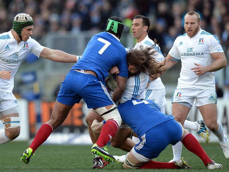 Crunching tackle: Try scorer Martin Castrogiovanni and flanker Fulgence Ouedraogo try to rip the ball off Pascal Pape