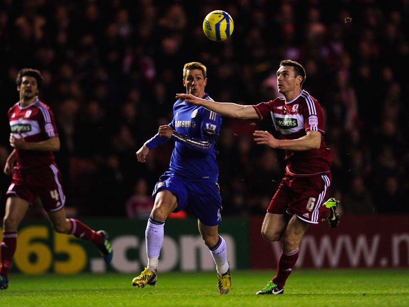 Fernando Torres and Stephen McManus battle for the ball during a goalless first half