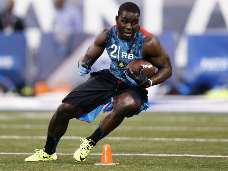 Running back Montee Ball does some drill work