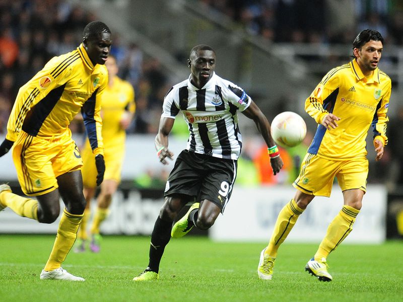 Newcastle striker Papiss Cisse chases for the ball