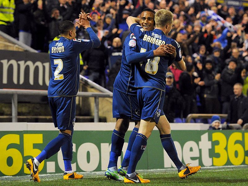 Oldham celebrate their early goal against Everton