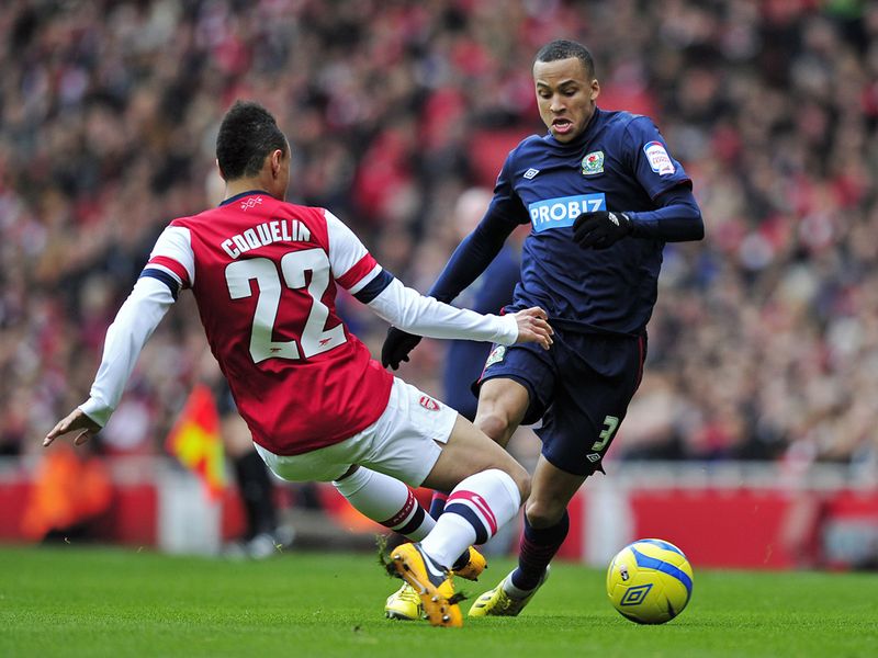 Arsenal midfielder Francis Coquelin and Blackburn's Martin Olsson battle for the ball