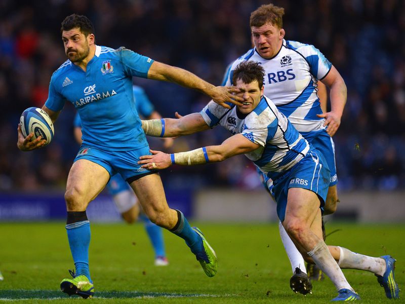 Hand off: Andrea Masi keeps Sean Lamont at bay