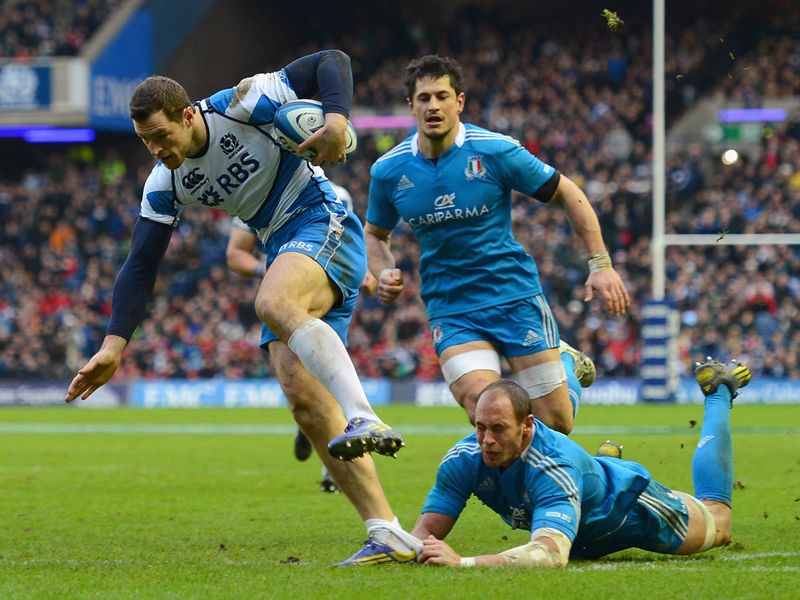 Breaking clear: Tim Visser breaks through the tackle of Sergio Parisse