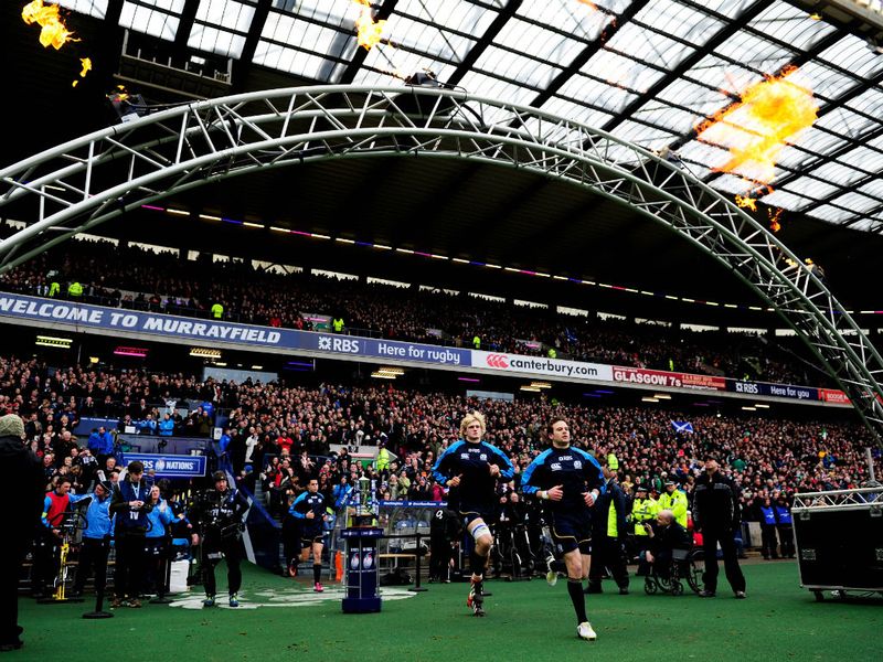 Scotland players run out ready for the clash against Ireland at a packed Murrayfield Stadium