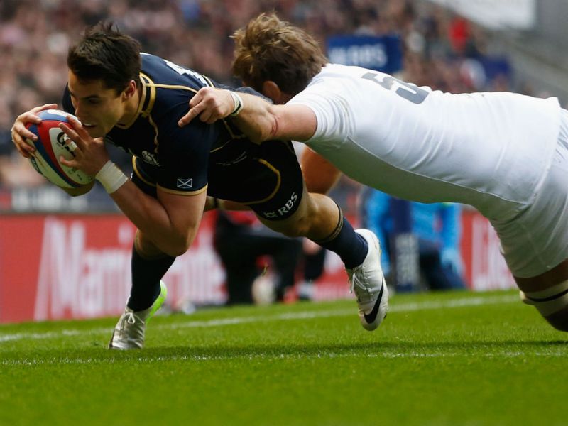 Opening try: Sean Maitland gives Scotland a shock lead as Geoff Parling tries in vain to stop him...