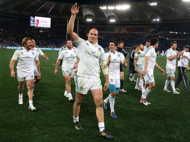 ...and Italian captain Sergio Parisse leads the celebrations at the Stadio Olympico