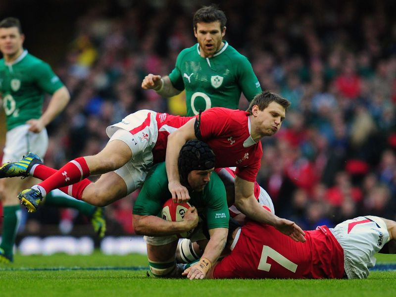 Early action: Wales fly-half Dan Biggar and Sam Warburton (7) put in a tackle on Ireland's Sean O' Brien