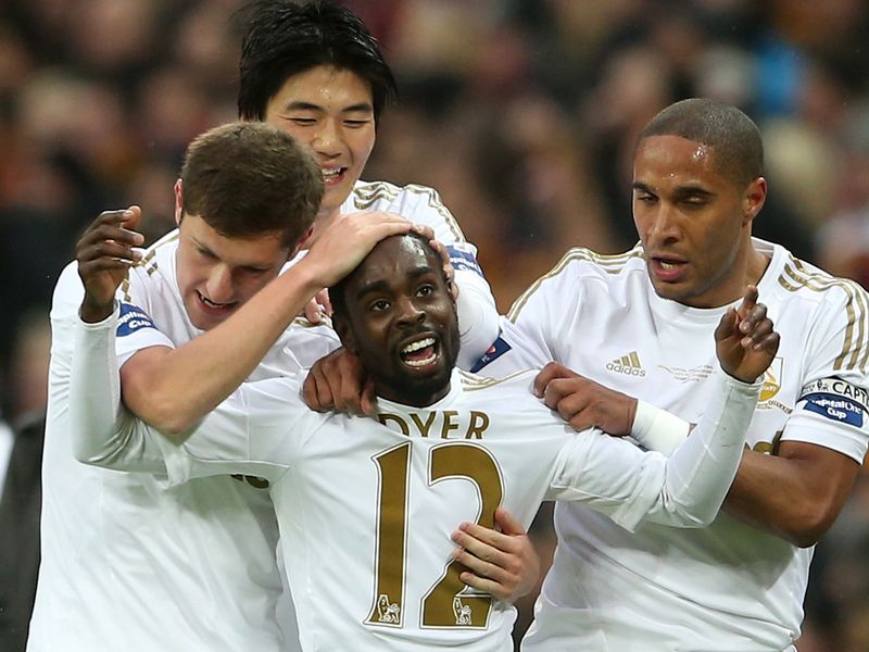 Swansea's players are full of smiles as they congratulate Dyer after going 1-0 ahead over the Bantams