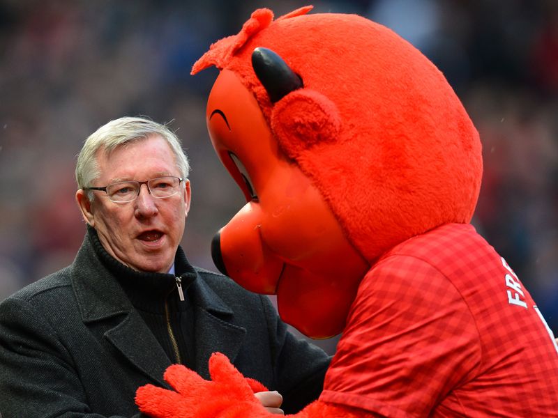 Sir Alex Ferguson gets some attention from Manchester United mascot Fred the Red.