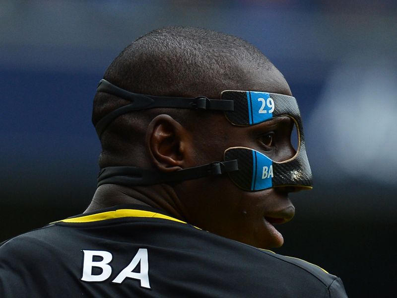 Demba Ba dons a protective mask on his return for Chelsea as they take on the reigning champions.