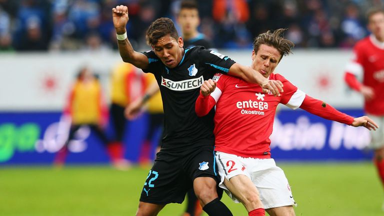 Roberto Firmino and Nicolai Mueller tussle for the ball