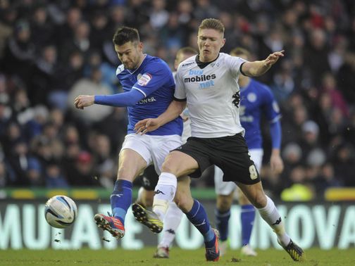 David Nugent is challenged by Derby's Jeff Hendrik