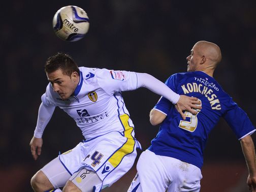 McCormack and Konchesky challenge for a high ball