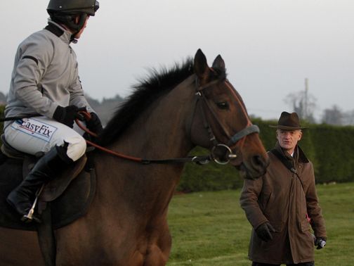 Quevega works under the watchful gaze of Willie Mullins