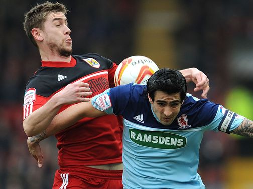 Steven Davies and Rhys Williams sandwich the ball