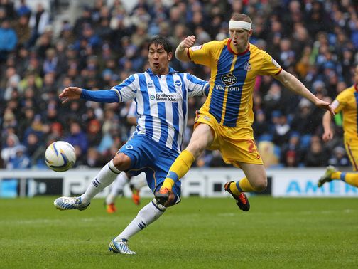 Leonardo Ulloa and Peter Ramage battle for the ball