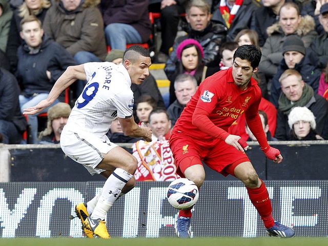 Jake Livermore keeps track of Luis Suarez.