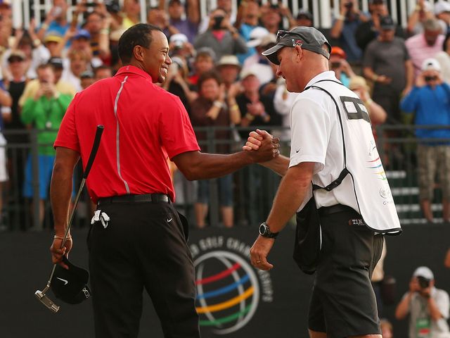Tiger Woods is congratulated by Joe LaCava