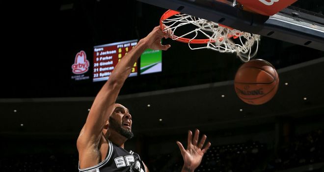 High-flying: Tim Duncan lead the Spurs to a win over the Cavaliers