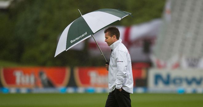 Umpire Paul Reiffel inspects the pitch