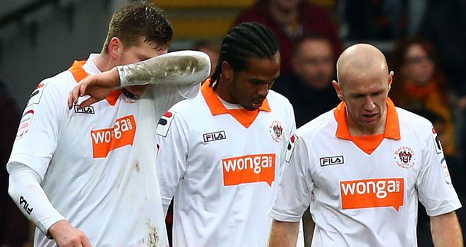 Gary MacKenzie: Struck (L) struck late for Blackpool