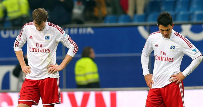 Hamburg's Marcell Jansen (l) and Tolgay Arslan are left dejected