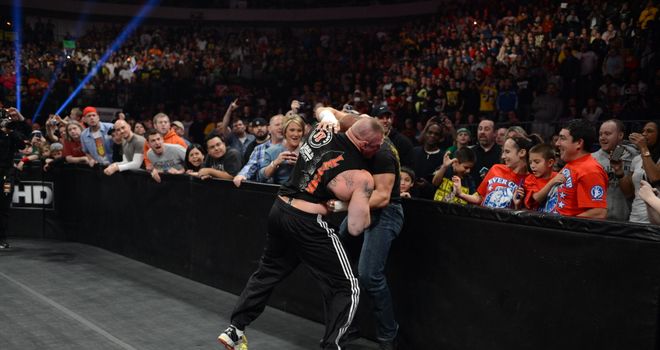 Best of enemies: Lesnar (L) and Triple H will go to war again at WrestleMania