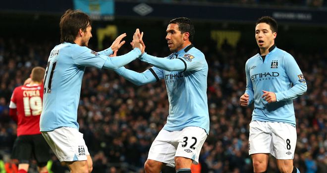 Manchester City celebrate on their way to a 5-0 success over Barnsley