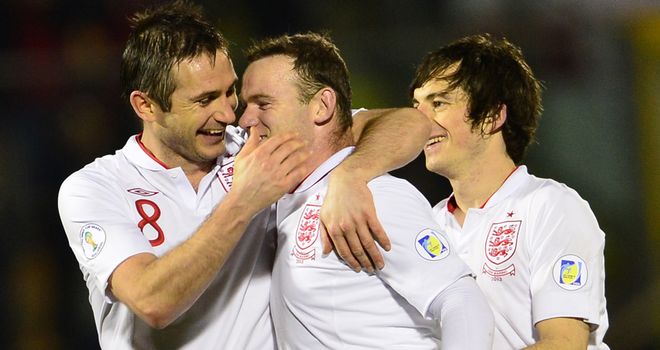 Job done: Lampard, Rooney and Baines celebrate their 8-0 win