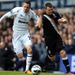 John Arne Riise holds off Gylfi Sigurdsson in the early stages between Tottenham and Fulham