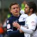 David Bentley and Shane Lowry square up as the games ends goalless