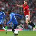 Tom Cleverley does well to avoid the challenge of Victor Moses