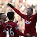The Manchester United striker is congratulated by his teammates