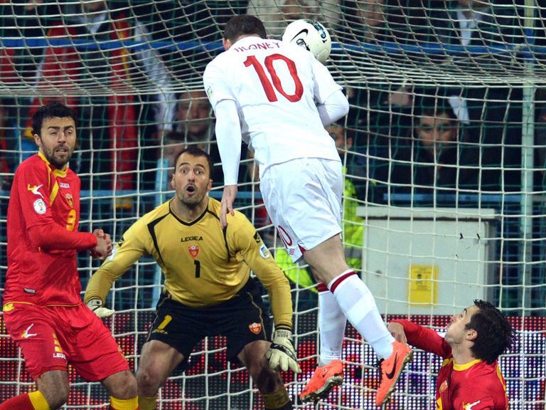 Wayne Rooney heads home against Montenegro.