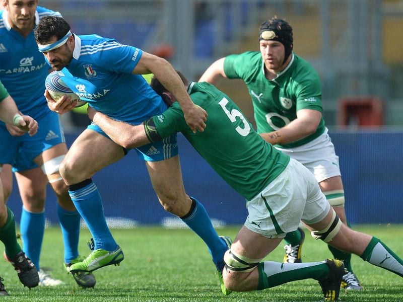 Holding on: Ireland lock Donnacha Ryan tackles Andrea Masi