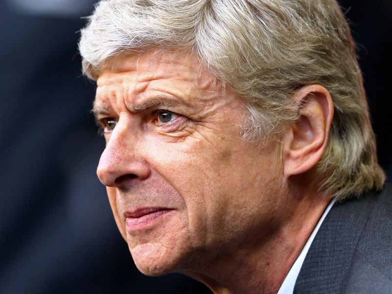 Arsenal boss Arsene Wenger watches the action from the touchline with a concerned look...
