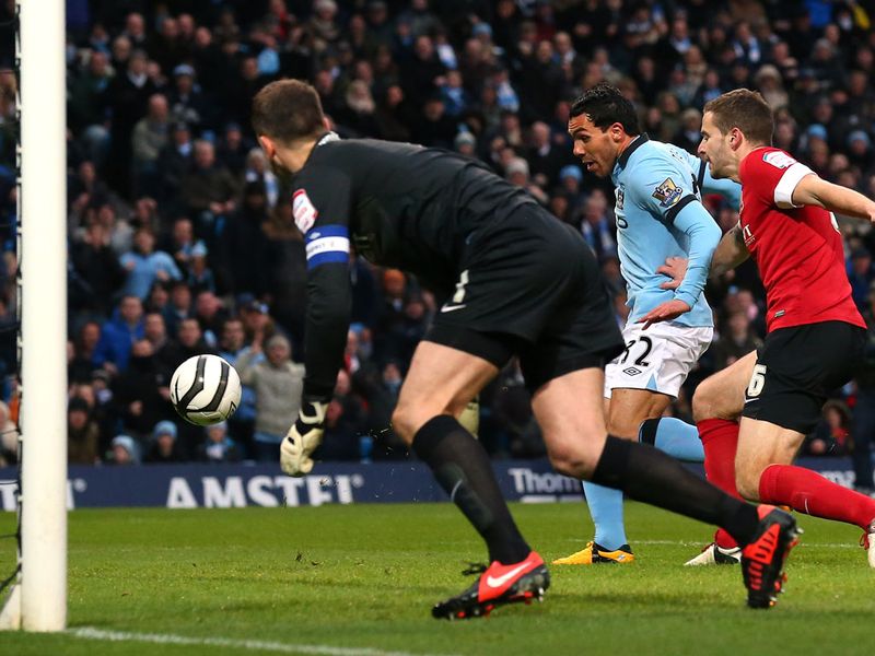 Carlos Tevez gives Manchester City the lead against Barnsley in Saturday's other quarter-final