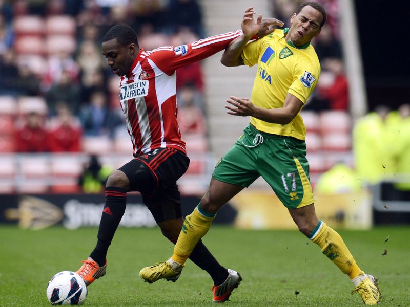 Danny Rose swings his arm back in the face of Elliott Bennett