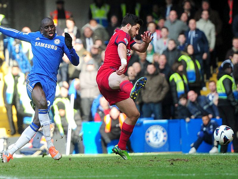 Demba Ba slides Chelsea into the lead at the Bridge