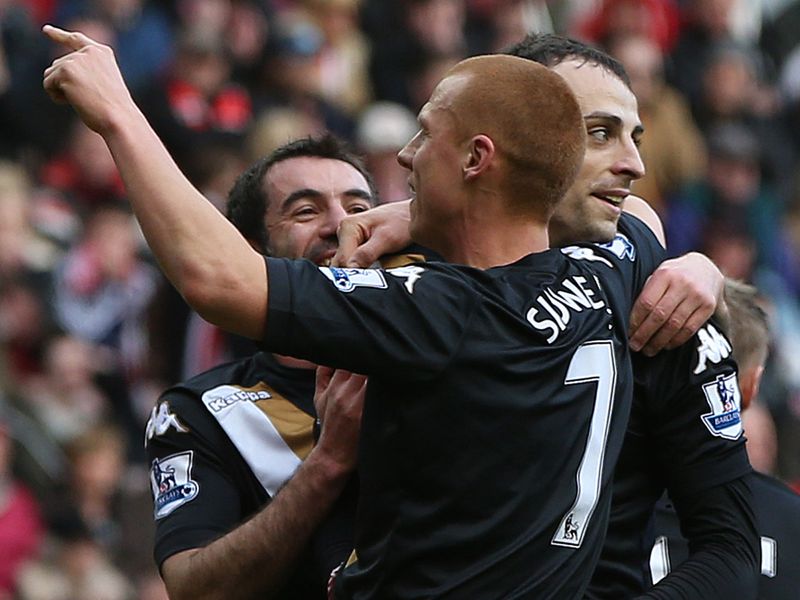 Berbatov is mobbed at the Stadium of Light