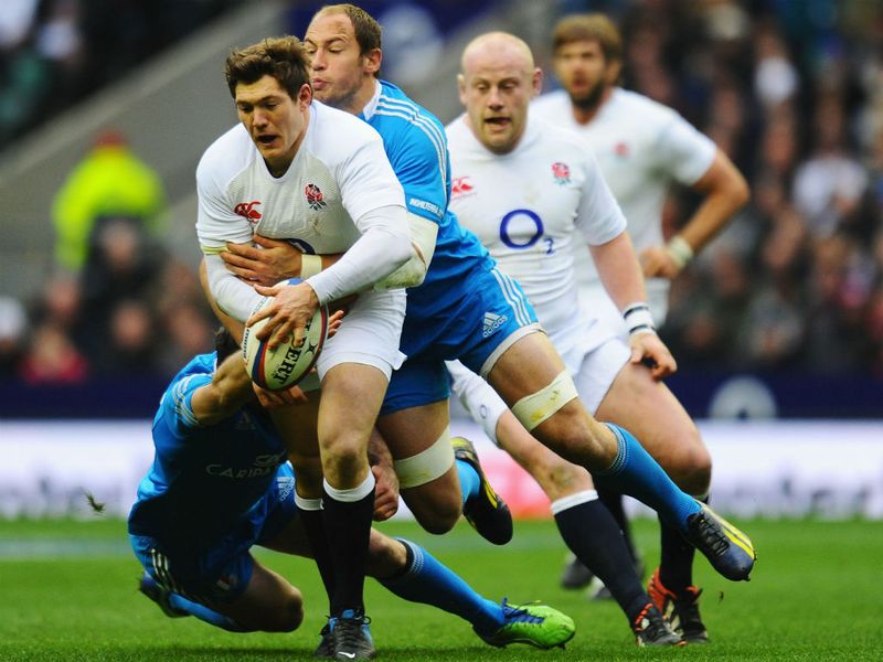 Stopped in his tracks: England's Alex Goode is tackled by Sergio Parisse