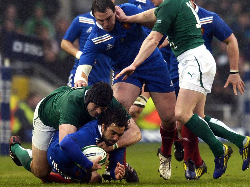 Fully committed: France full-back Yoann Huget is tackled by Ireland's hooker Rory Best