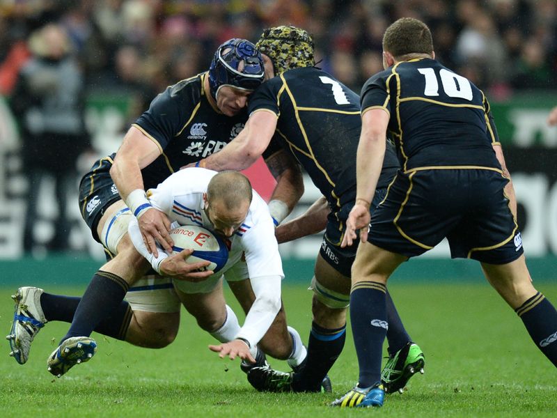Stopped in his tracks: The Scottish defence halt Frederic Michalak's run