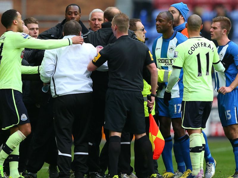 Assistant Newcastle boss John Carver clashes with Callum McManaman at the break